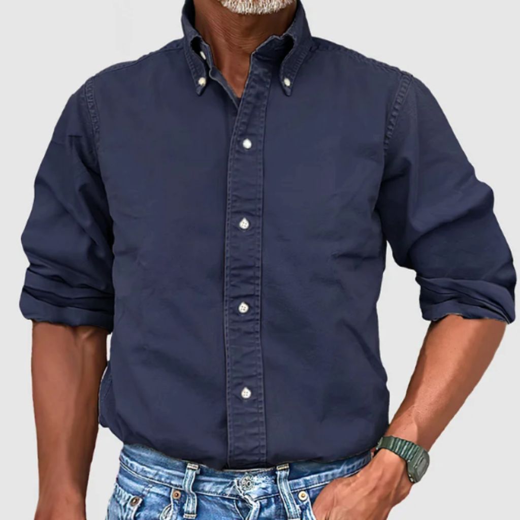 "Men's regular fit long-sleeve button-down shirt with classic collar, rolled cuffs, and durable polyester fabric."