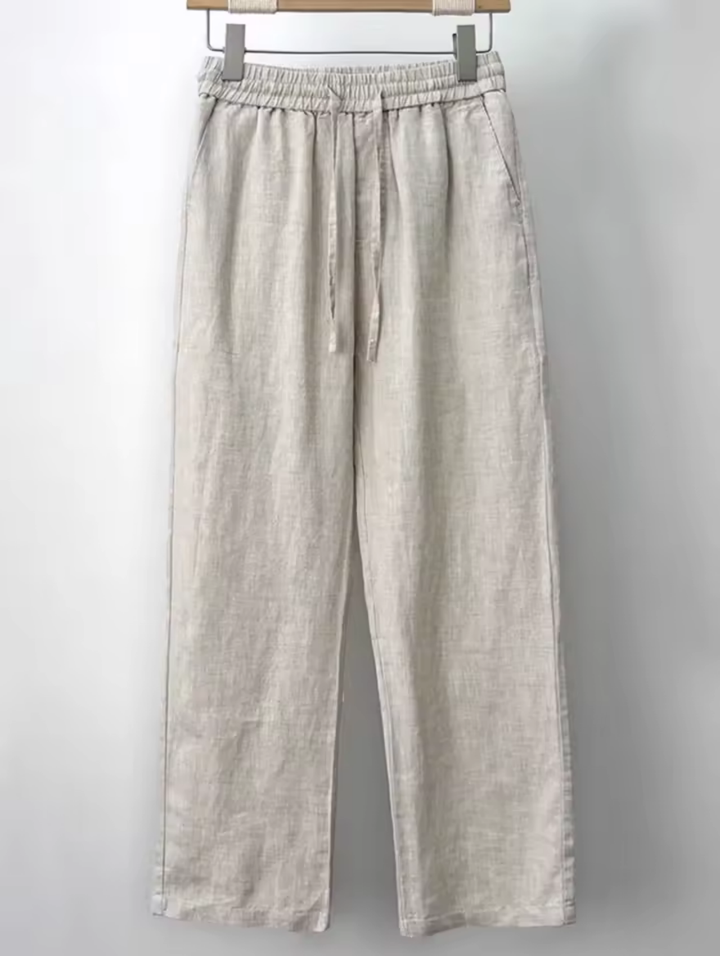 "Men's relaxed fit linen pants in beige, front view, lightweight fabric, perfect for casual and refined occasions."