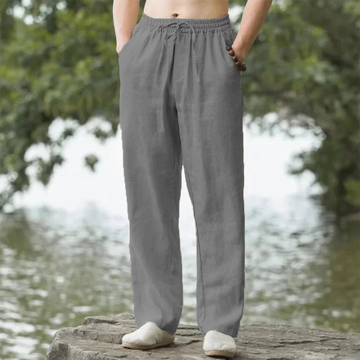 Men's relaxed linen beach pants, lightweight and airy with adjustable drawstring, perfect for casual summer comfort.