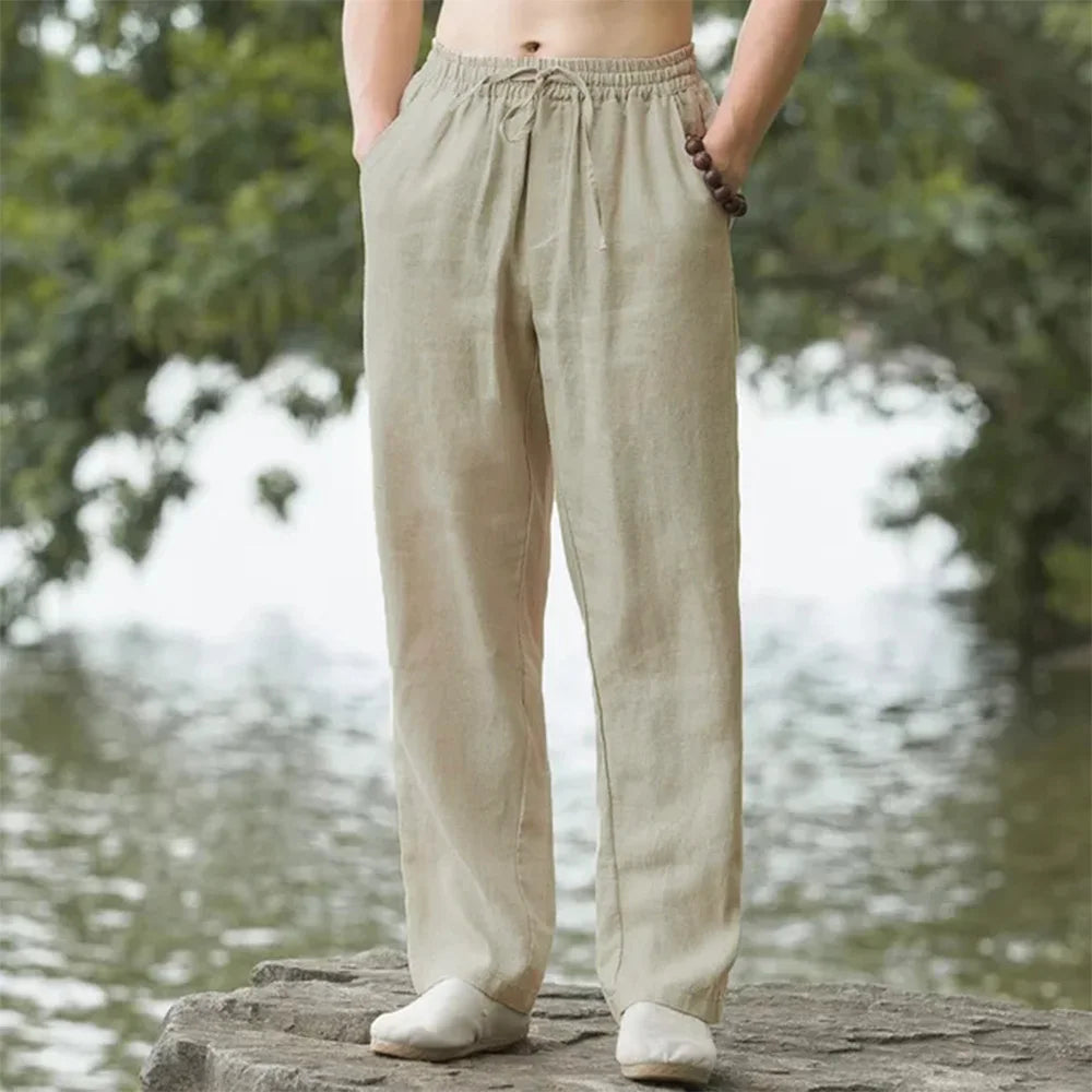 Men's relaxed linen beach pants, lightweight and airy with adjustable drawstring, perfect for casual summer comfort.