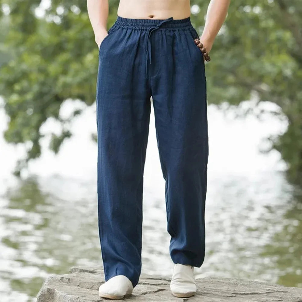 Men's relaxed linen beach pants, lightweight and airy with adjustable drawstring, perfect for casual summer comfort.