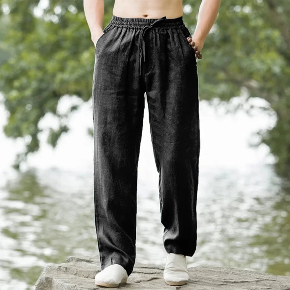 Men's relaxed linen beach pants, lightweight and airy with adjustable drawstring, perfect for casual summer comfort.