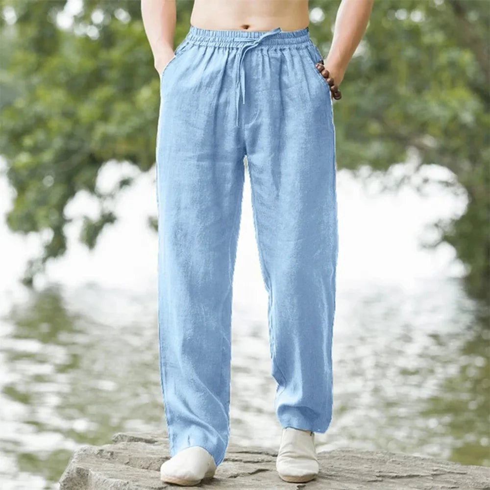 Men's relaxed linen beach pants, lightweight and airy with adjustable drawstring, perfect for casual summer comfort.
