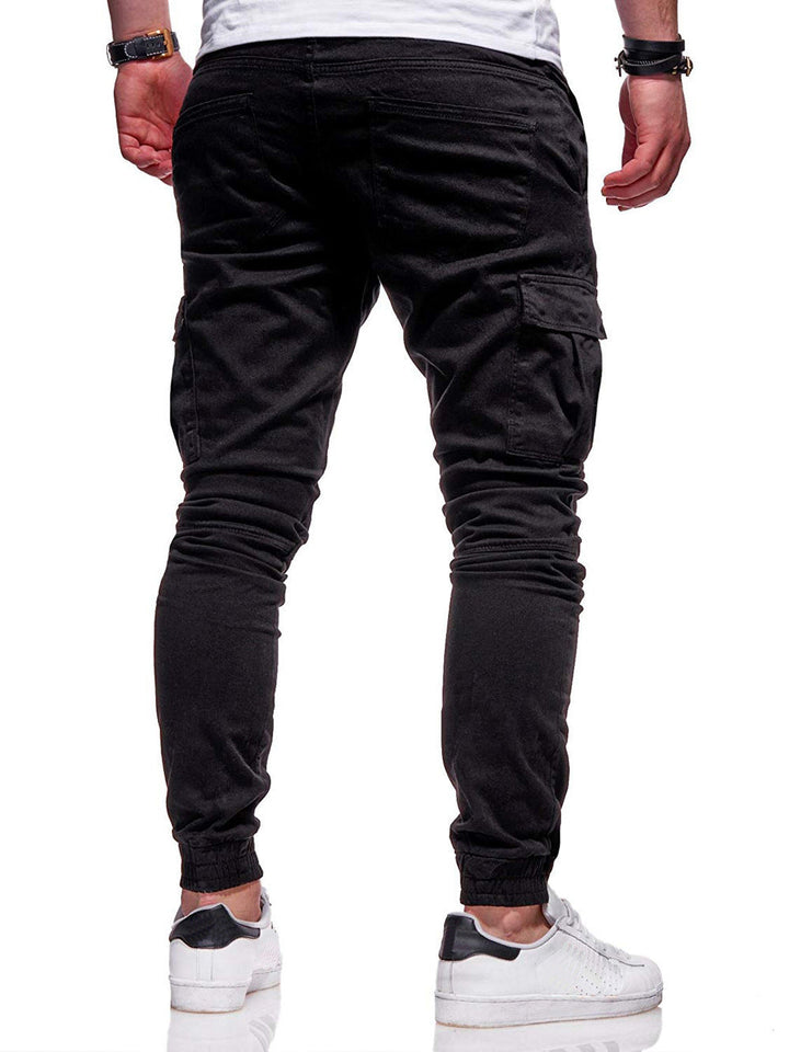 "Men's slim-fit cargo joggers with pockets, breathable cotton, elastic waistband, versatile and stylish for active lifestyles