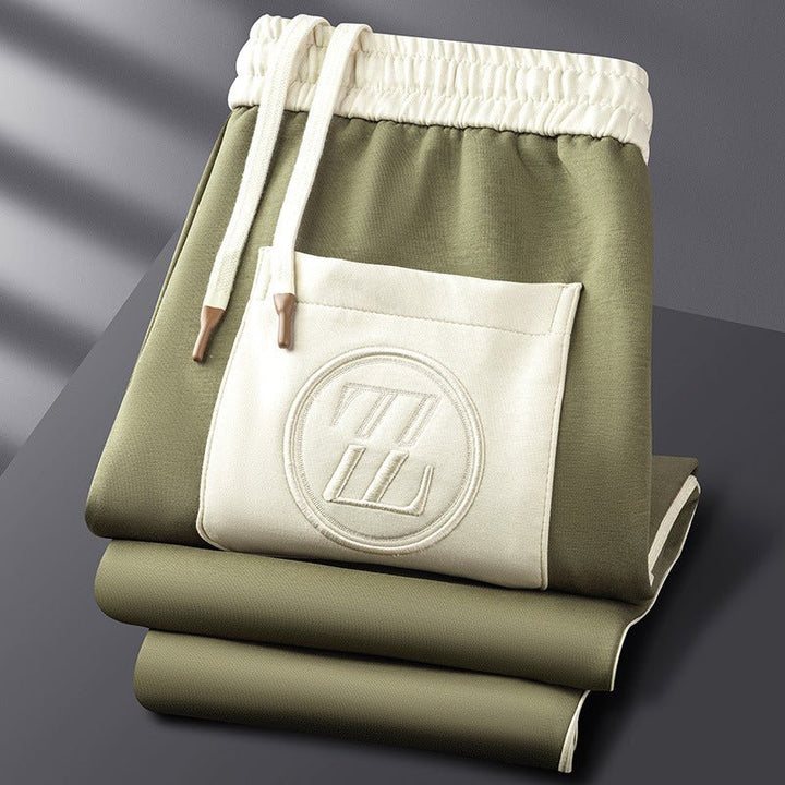 "Men's sporty tracksuit set lycra fabric, sleek lines, stripe accents, tailored fit, showcasing athletic physique."