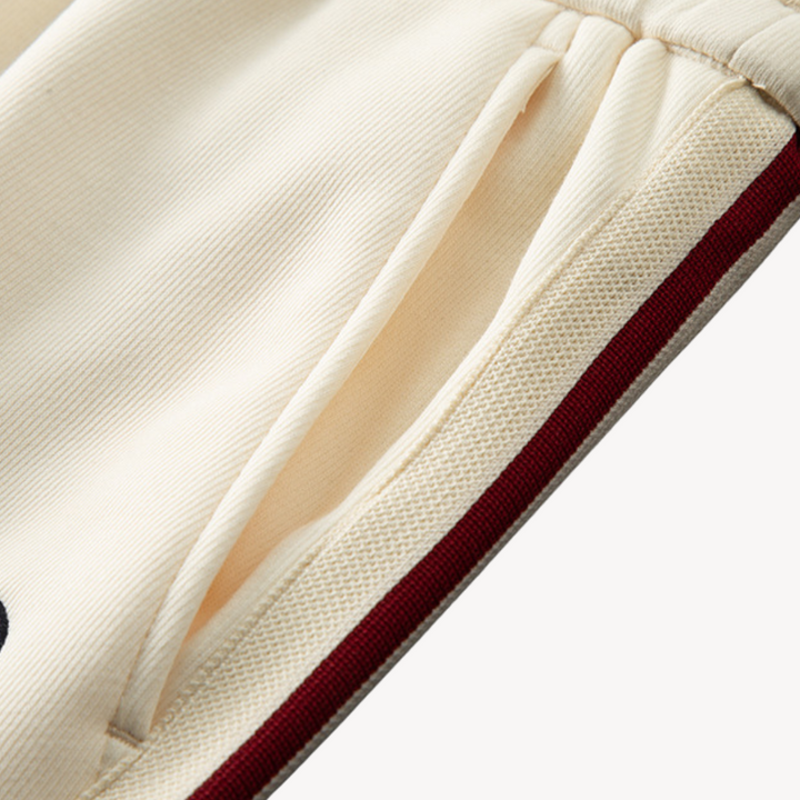 Men's stylish cotton tracksuit set with zip-up hoodie and joggers in neutral colors; perfect for casual wear and lounging.