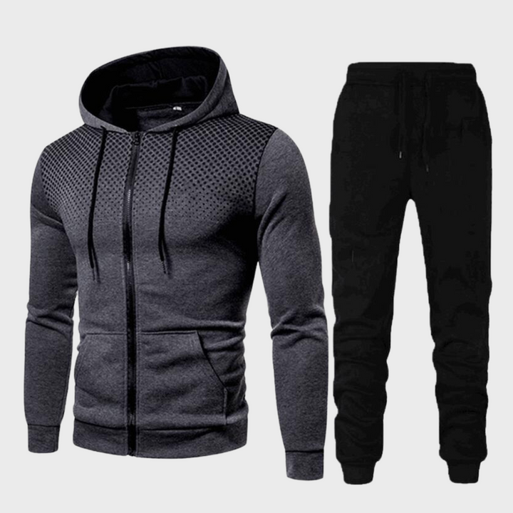 Men's stylish tracksuit with zip-up hoodie and sleek tapered trousers, perfect for casual outings or lounging in comfort.