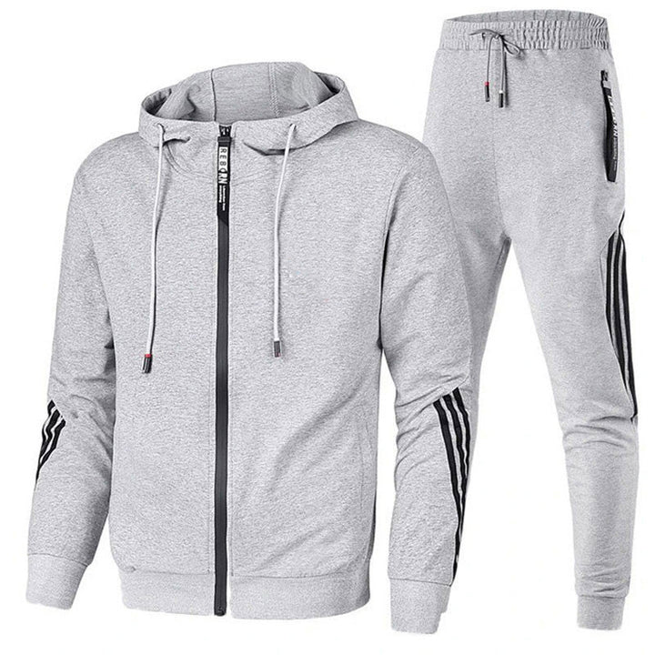"Men's stylish two-piece tracksuit in black, side view, relaxed fit, versatile design, ideal for casual or active wear."