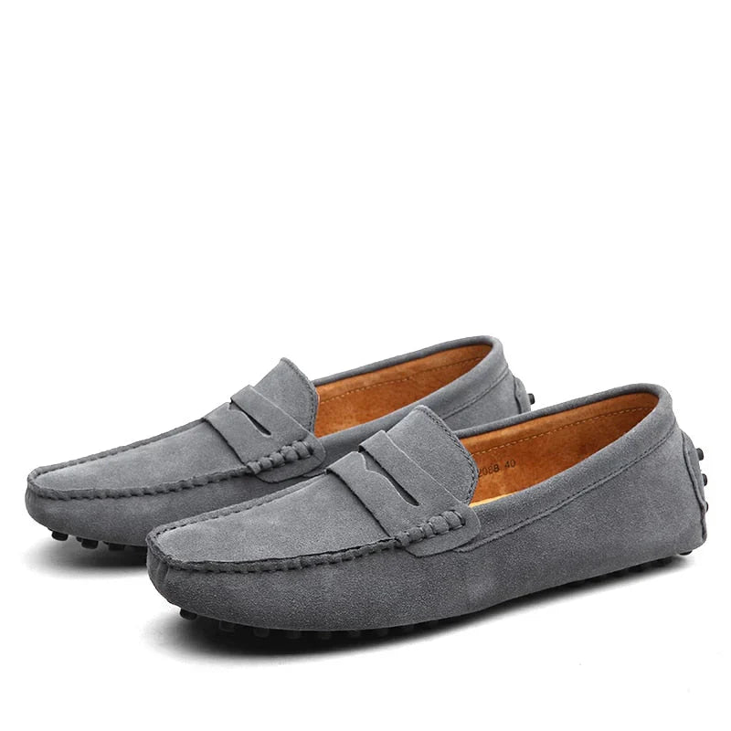 "Men's suede driving loafers with flexible sole, showcasing elegant design and non-slip rubber grip."