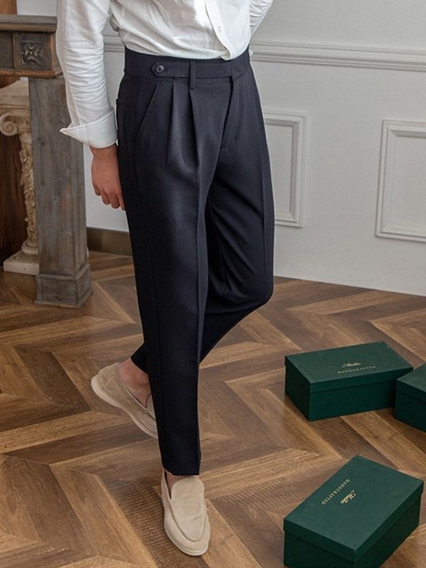 Men’s tailored essential trousers in classic colors, streamlined fit, perfect for formal or casual wear, showcasing elegance.