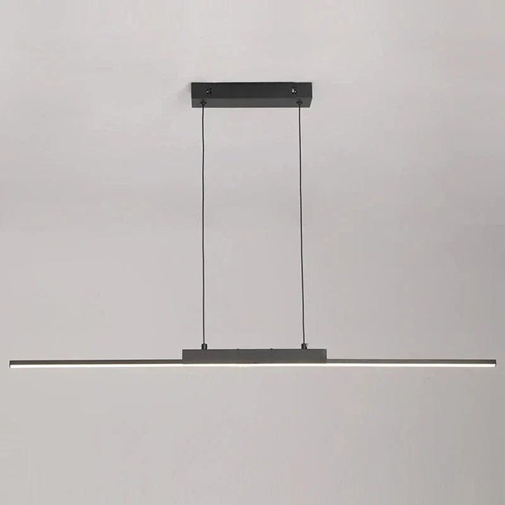 "Modern black pendant light with tubular silhouette, minimalist aluminium fixture, perfect for dining rooms and kitchens."