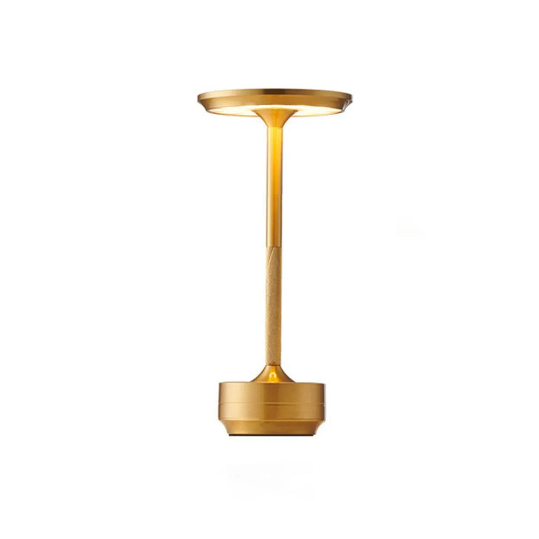 Modern cordless table lamp with touch control, Nordic design, gold frame, brushed finish, illuminating a stylish room.