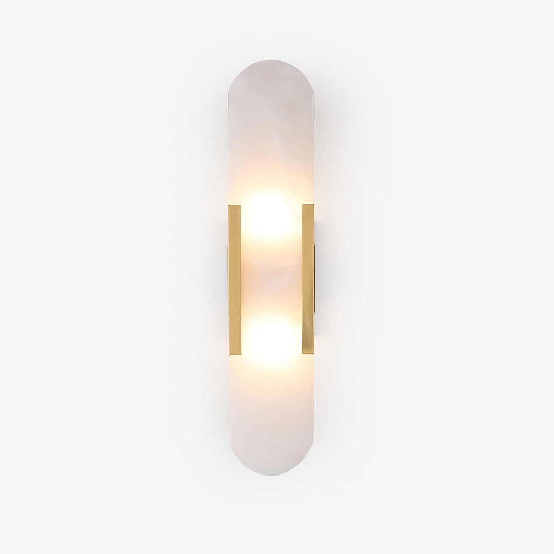 "Modern elongated alabaster wall lamp with metal and brass accents, emits warm glow, suitable for chic interior decor."