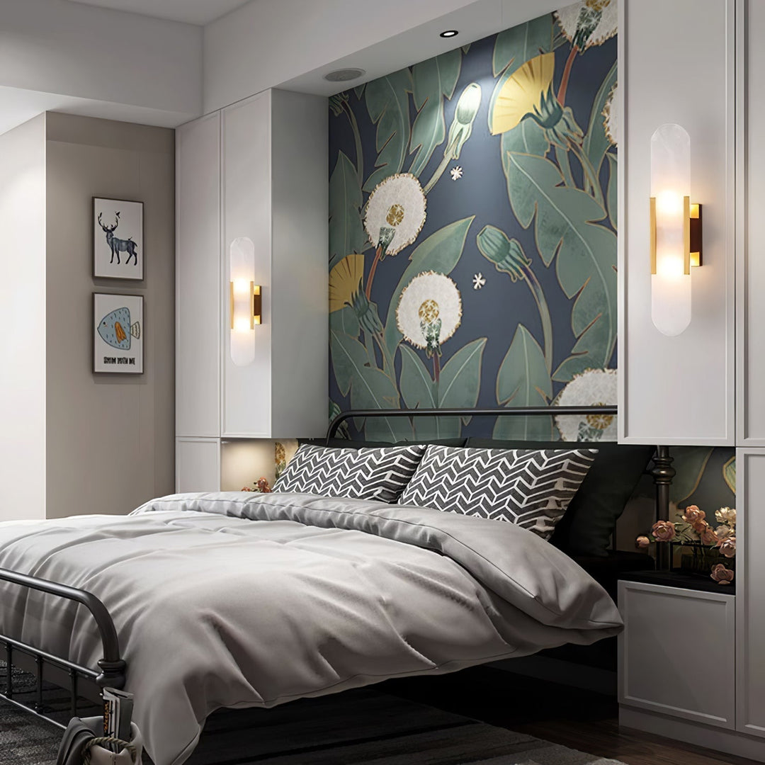 "Modern elongated alabaster wall lamp with metal and brass accents, emits warm glow, suitable for chic interior decor."