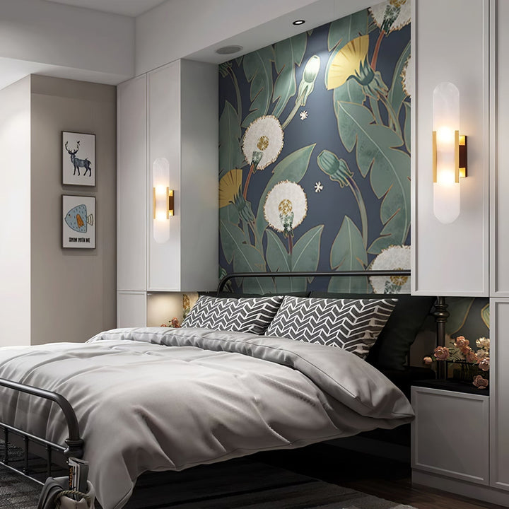 "Modern elongated alabaster wall lamp with metal and brass accents, emits warm glow, suitable for chic interior decor."