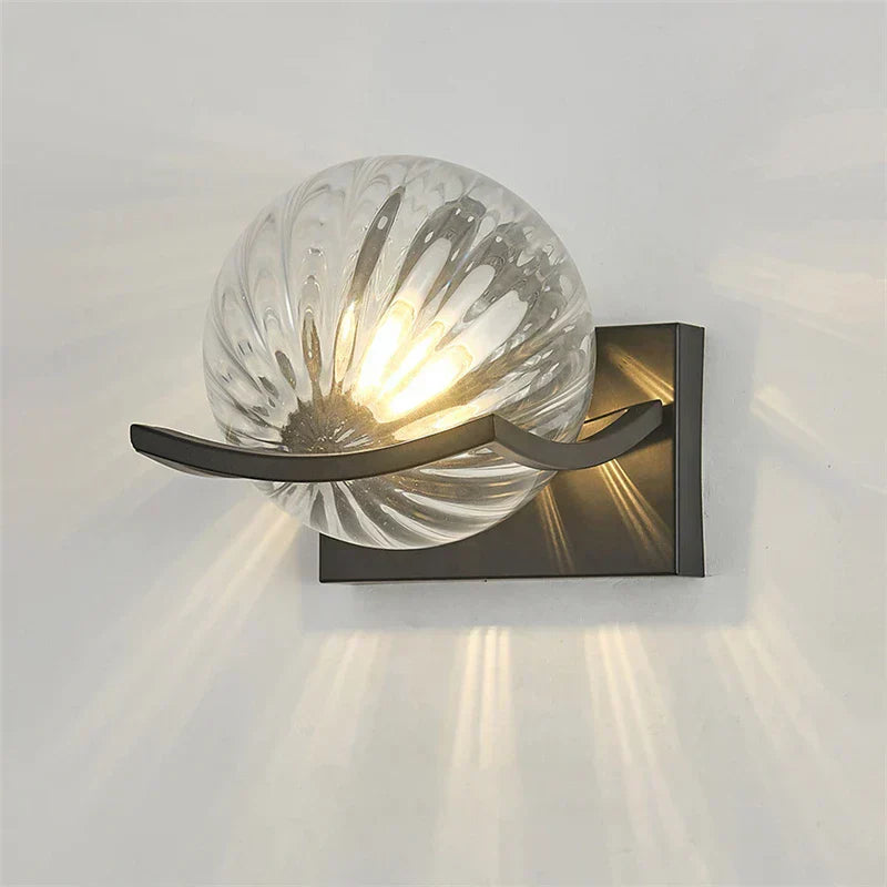 "Modern LED wall lamp with sleek glass finish, ideal for contemporary home decor and energy-efficient lighting."