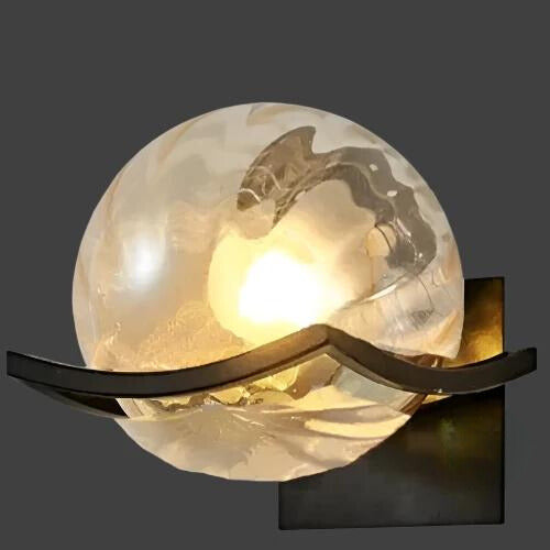 "Modern LED wall lamp with sleek glass finish, ideal for contemporary home decor and energy-efficient lighting."