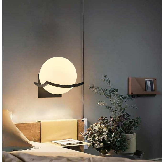 "Modern LED wall lamp with sleek glass finish, ideal for contemporary home decor and energy-efficient lighting."