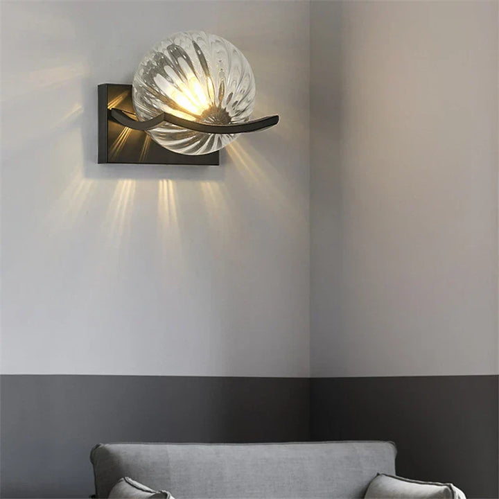 "Modern LED wall lamp with sleek glass finish, ideal for contemporary home decor and energy-efficient lighting."