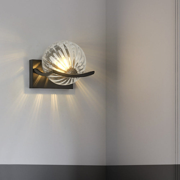 "Modern LED wall lamp with sleek glass finish, ideal for contemporary home decor and energy-efficient lighting."