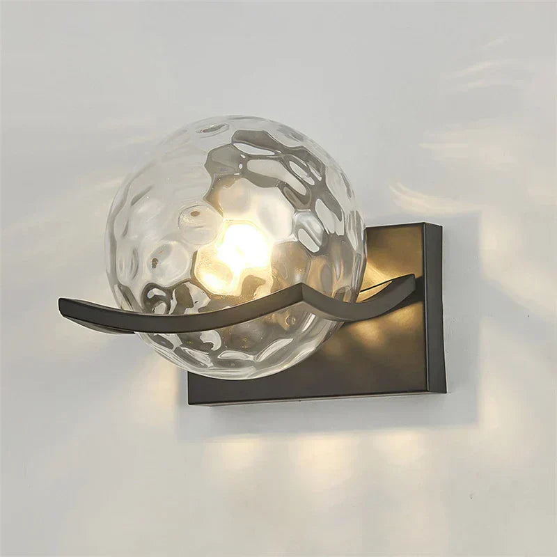 "Modern LED wall lamp with sleek glass finish, ideal for contemporary home decor and energy-efficient lighting."
