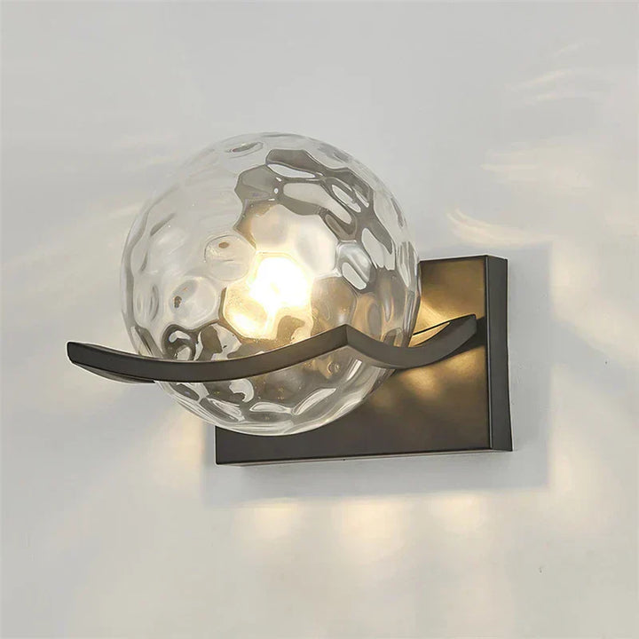 "Modern LED wall lamp with sleek glass finish, ideal for contemporary home decor and energy-efficient lighting."