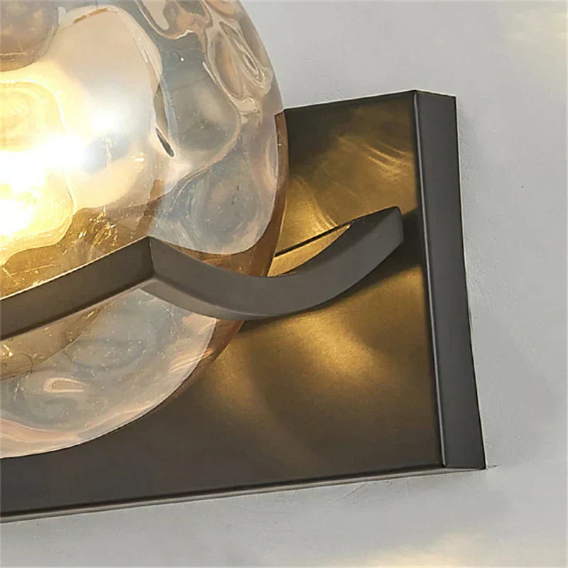"Modern LED wall lamp with sleek glass finish, ideal for contemporary home decor and energy-efficient lighting."