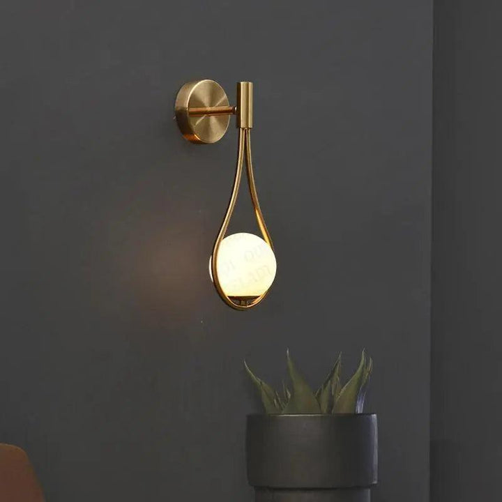 "Modern Nordic wall lamp with elegant gold and black finish, featuring minimalist design and clean lines for any room decor."