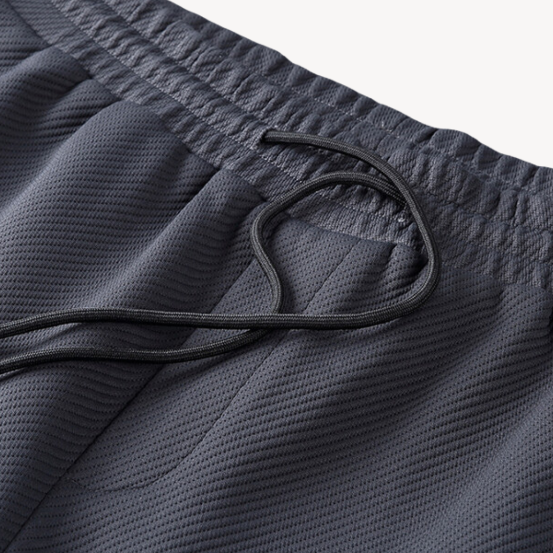 "Navy and black men's tracksuit set with zip jacket and joggers, showcasing sleek design and comfort for casual or gym wear."