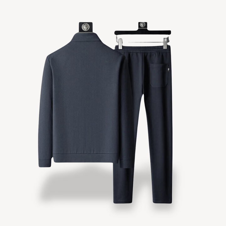 "Navy and black men's tracksuit set with zip jacket and joggers, showcasing sleek design and comfort for casual or gym wear."