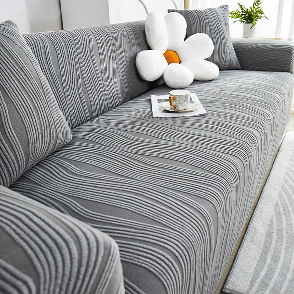 Pet-friendly jacquard stretch sofa cover in stylish design, protects against scratches and complements any decor.