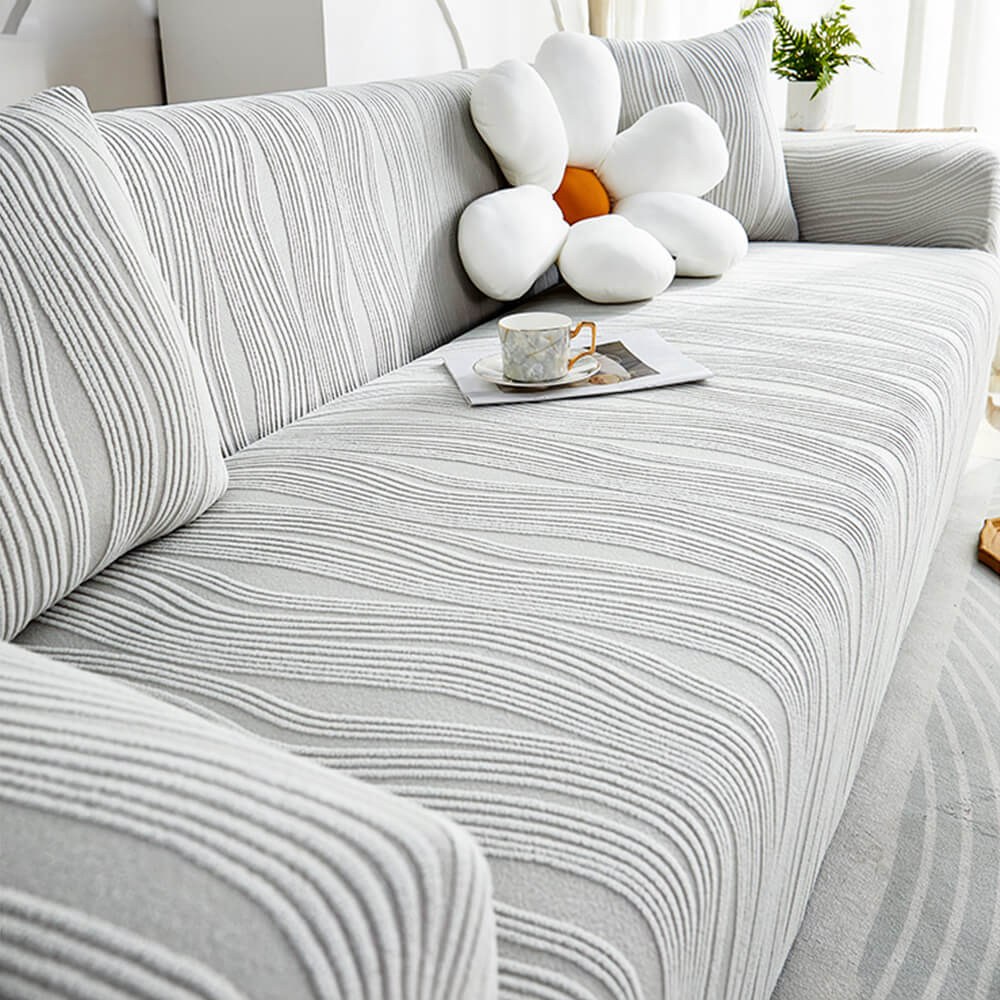 Pet-friendly jacquard stretch sofa cover in stylish design, protects against scratches and complements any decor.