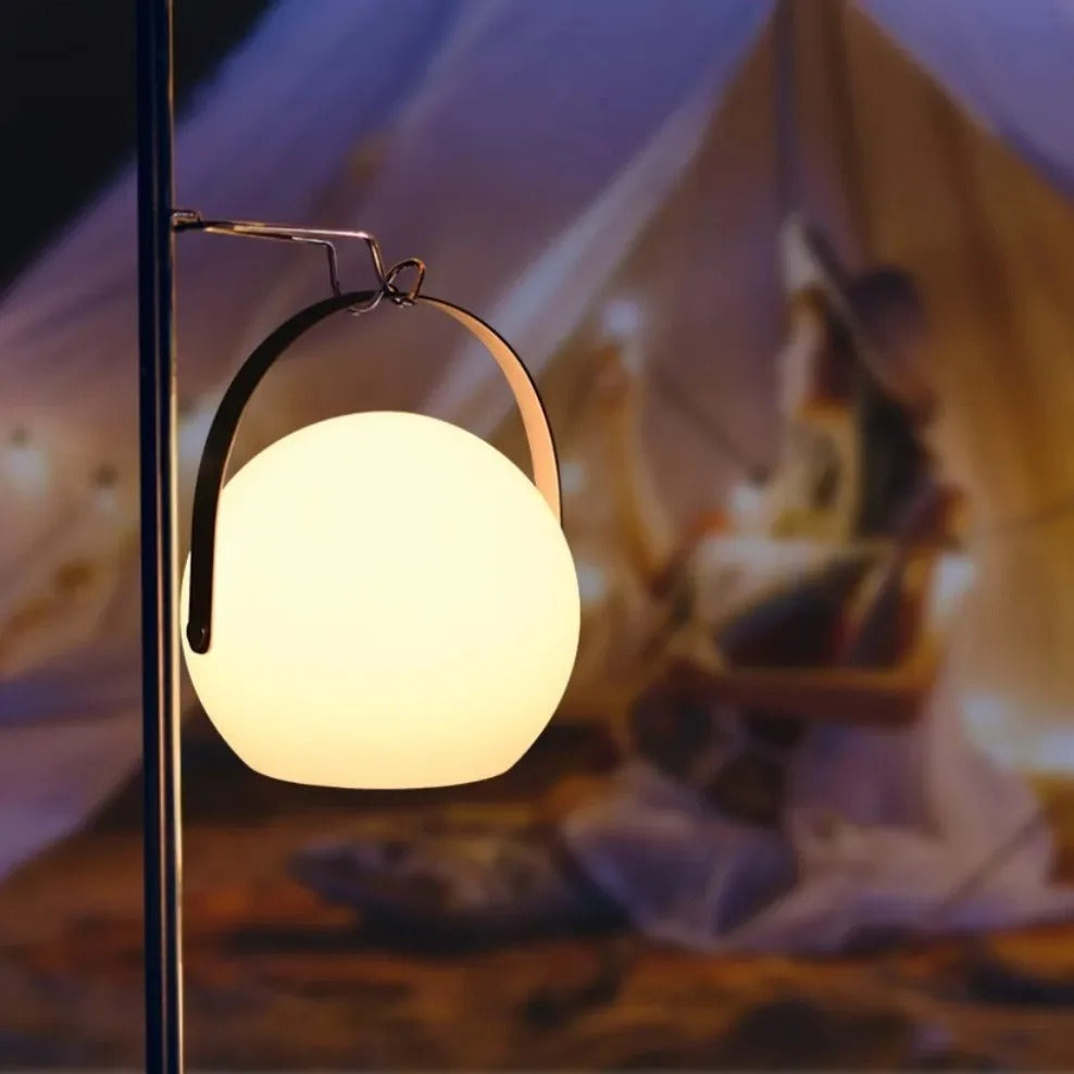 Portable waterproof cordless lamp with remote control, sleek modern design, suitable for indoor and outdoor lighting.