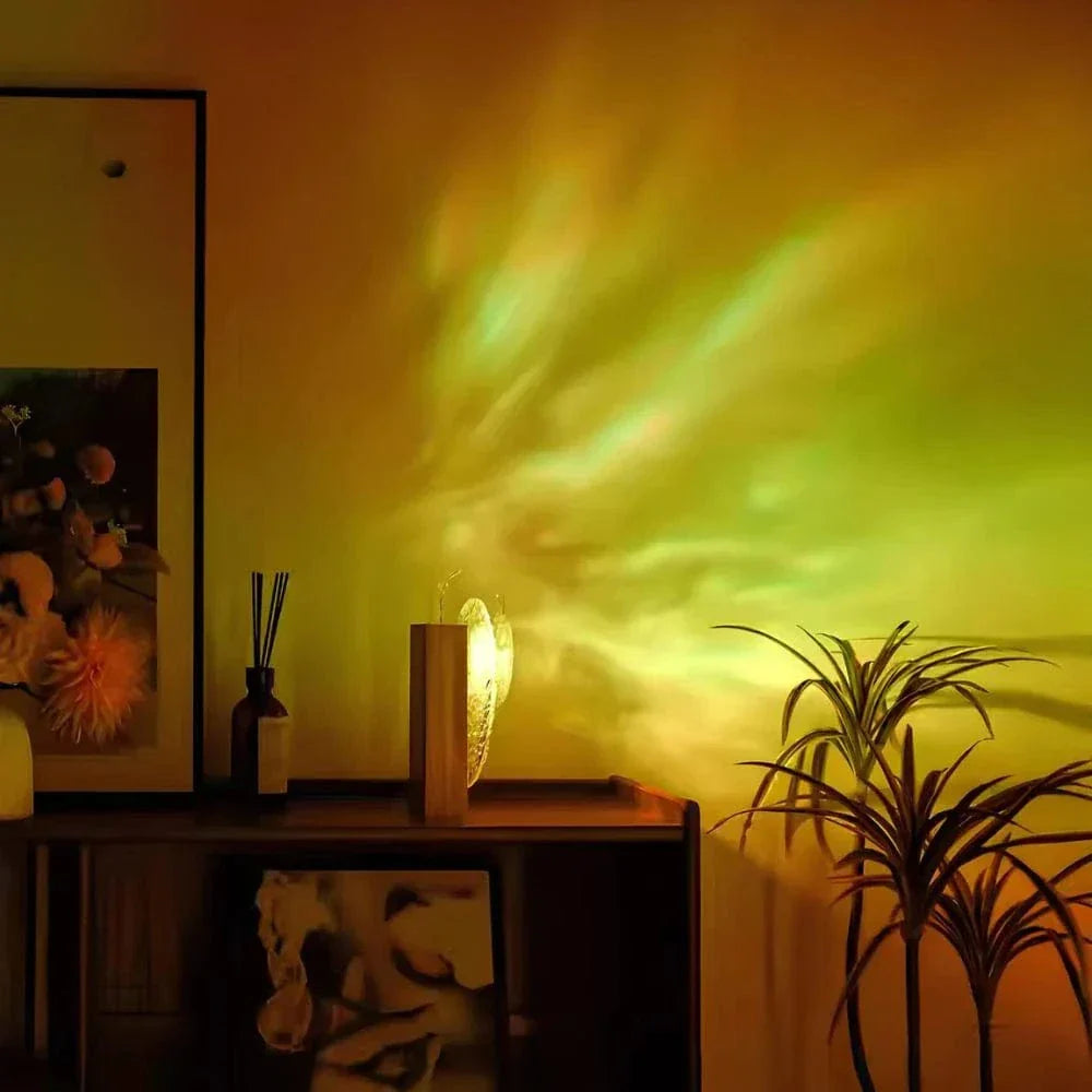 "Rechargeable LED lamp projects sunset hues, ocean waves; adds cozy ambiance to home decor with adjustable head."