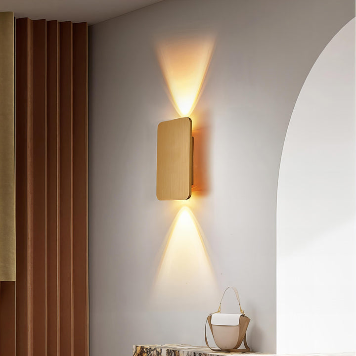 "Sleek indoor LED wall lamp with a modern rectangular design, featuring smooth finishes and warm illumination for elegant dec