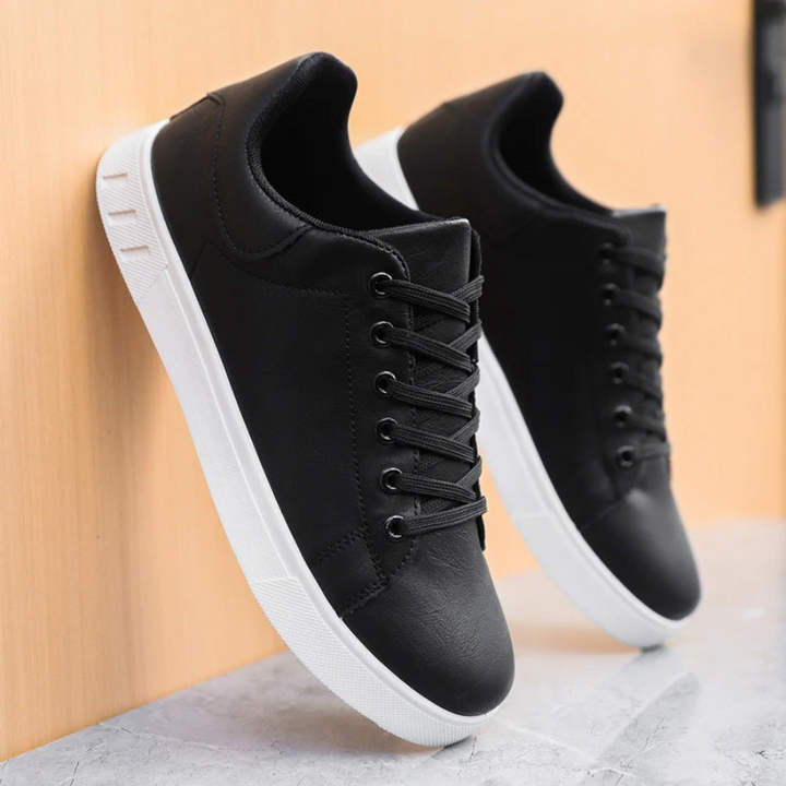 Sleek men's stylish leather sneakers side view, showcasing premium quality and modern design for versatile, casual chic wear.