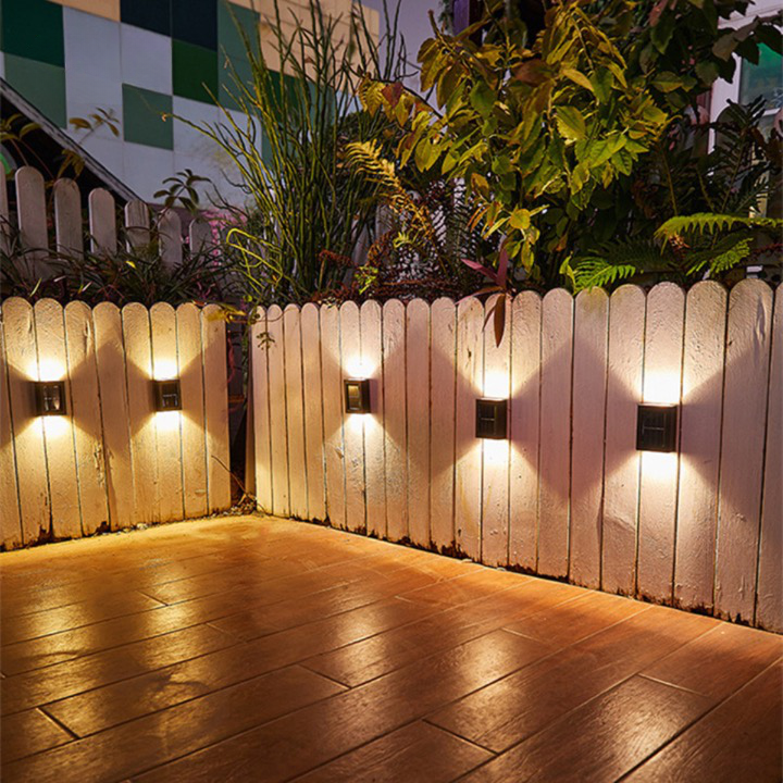 Solar-powered LED wall lights with sleek, black design, perfect for eco-friendly outdoor garden illumination and easy install