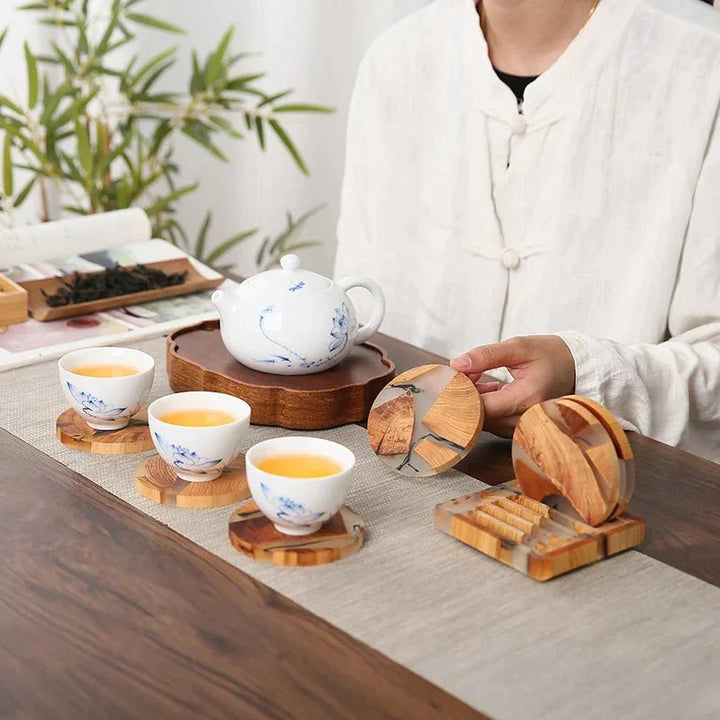"Solid wood coasters with Japanese design, featuring natural tones and vibrant resin accents, perfect for table protection."
