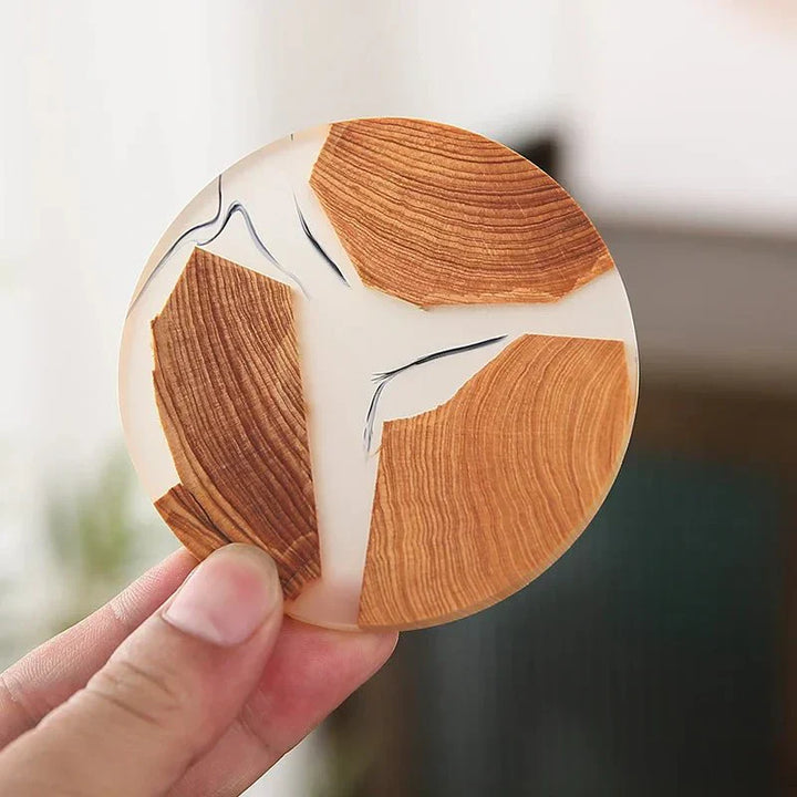 "Solid wood coasters with Japanese design, featuring natural tones and vibrant resin accents, perfect for table protection."