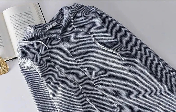 Unisex hooded shirt in lightweight fabric, showcasing breathable material and casual design with versatile unisex fit.