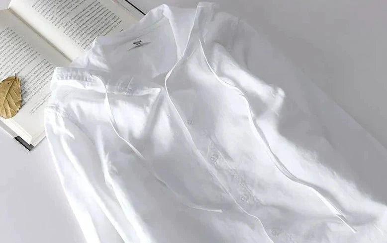 Unisex hooded shirt in lightweight fabric, showcasing breathable material and casual design with versatile unisex fit.