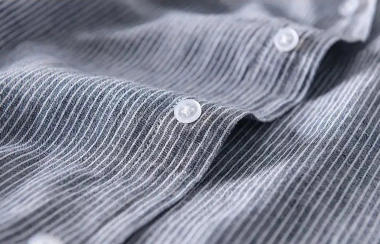 Unisex hooded shirt in lightweight fabric, showcasing breathable material and casual design with versatile unisex fit.