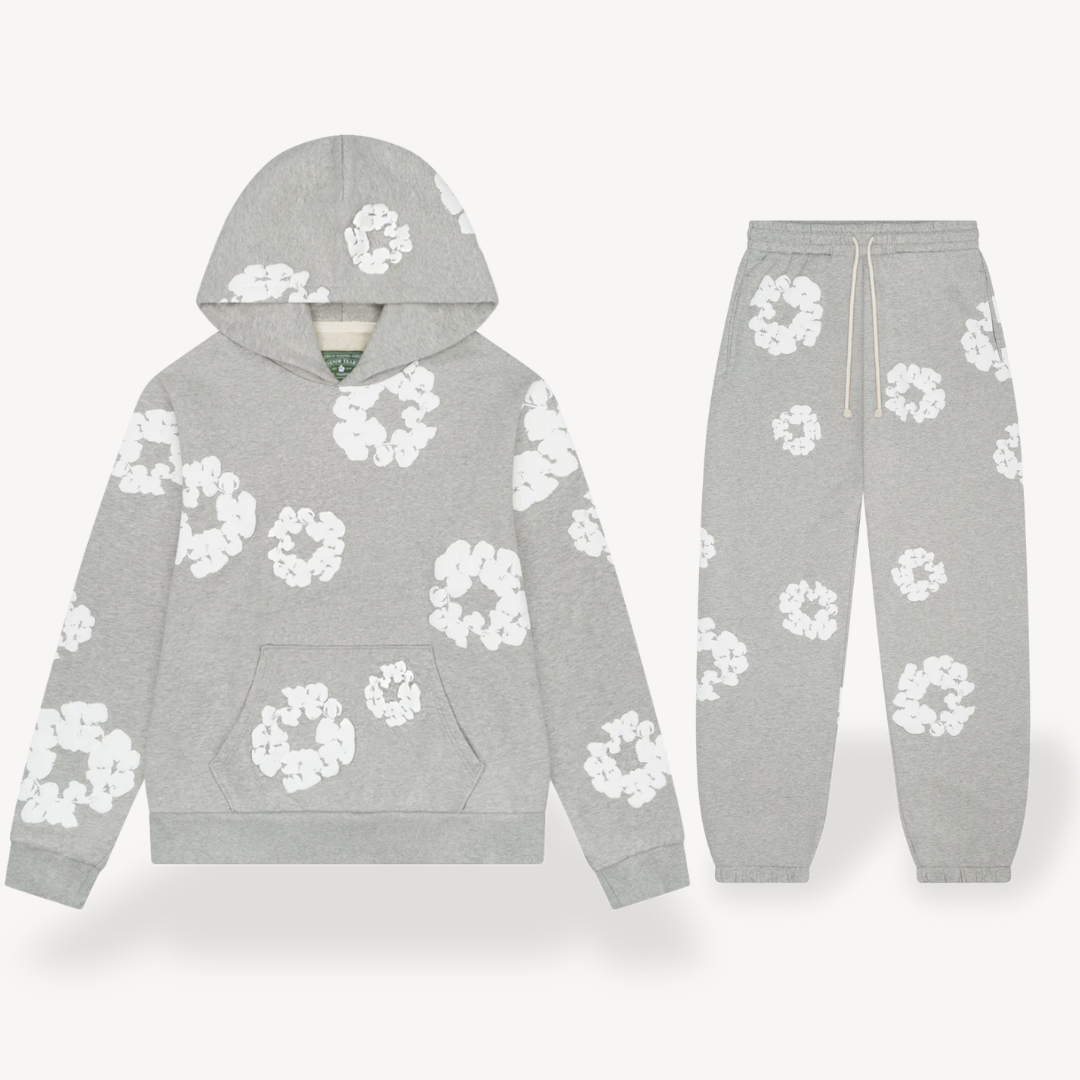 Unisex hoodie with bold white floral graphics on black cotton, combines style and comfort for a standout look.