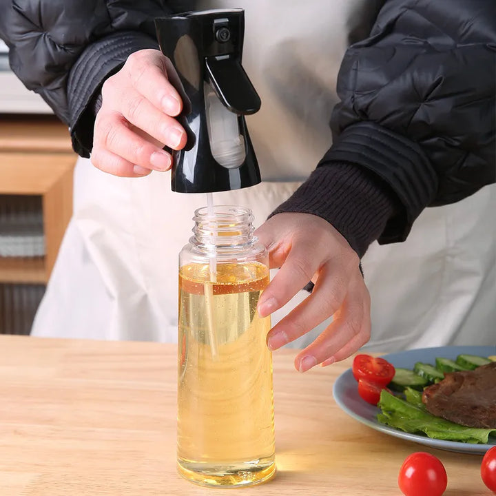 "Versatile refillable oil spray bottle, transparent body, fine mist spray, eco-friendly plastic, ideal for home chefs and coo
