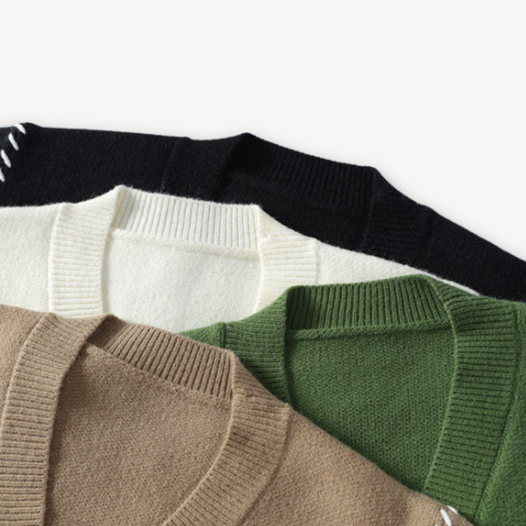 "White men's wool cardigan sweater with button-up front, ribbed cuffs, and black stitch detail for stylish winter wear."