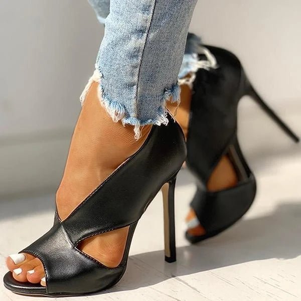 "Women's black & brown open-toe stiletto heels with side cutouts, peep-toe design, sleek silhouette, and slip-on style."