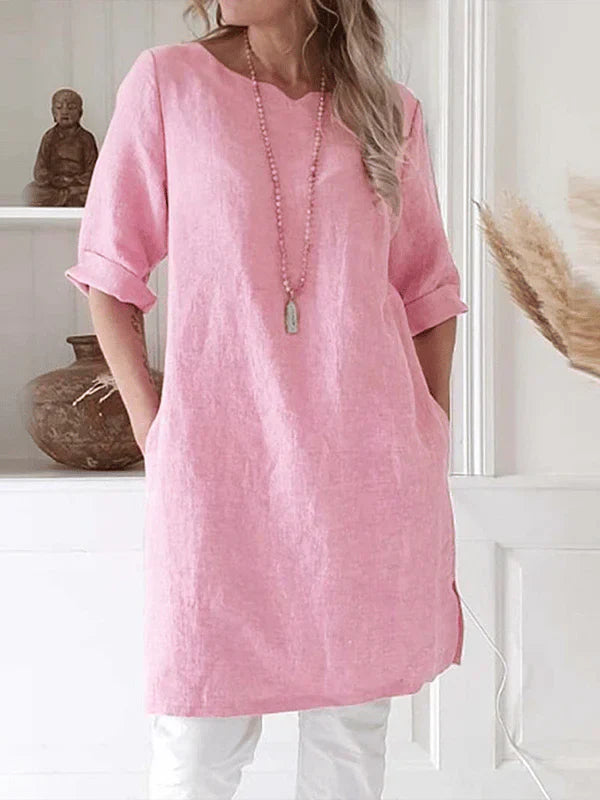 "Women's breathable linen tunic dress with relaxed fit and rolled 3/4 sleeves, featuring soft fabric for stylish comfort."