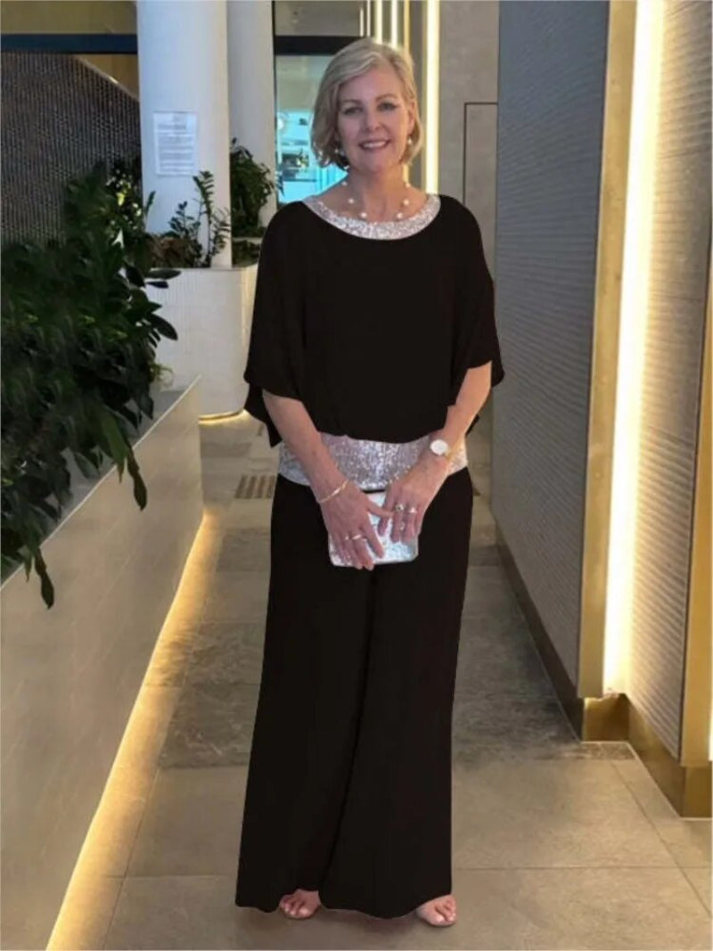 "Women's elegant chiffon set with sequin accents, featuring batwing-sleeve blouse and versatile wide-leg trousers."