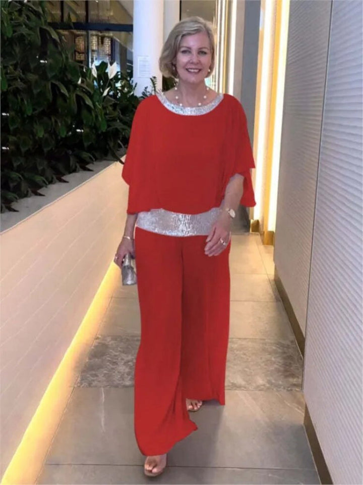 "Women's elegant chiffon set with sequin accents, featuring batwing-sleeve blouse and versatile wide-leg trousers."