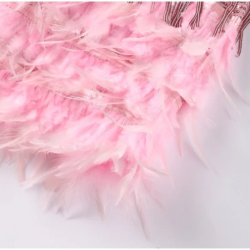 "Women's feather mini dress with elegant detailing, chic silhouette and luxurious feather accents for special occasions."